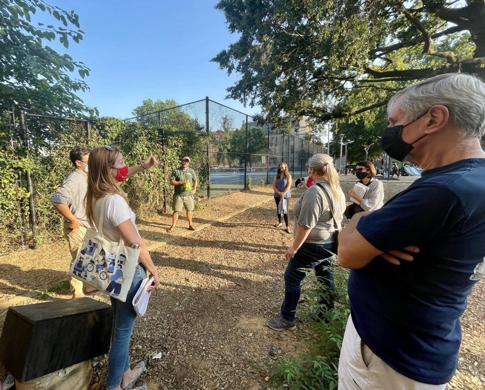 Volunteers and neighbors touring the Powell Communal Farm